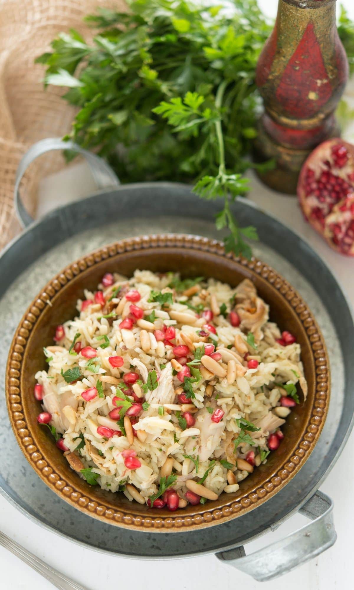 pilaf salad in a brown bowl with chicken