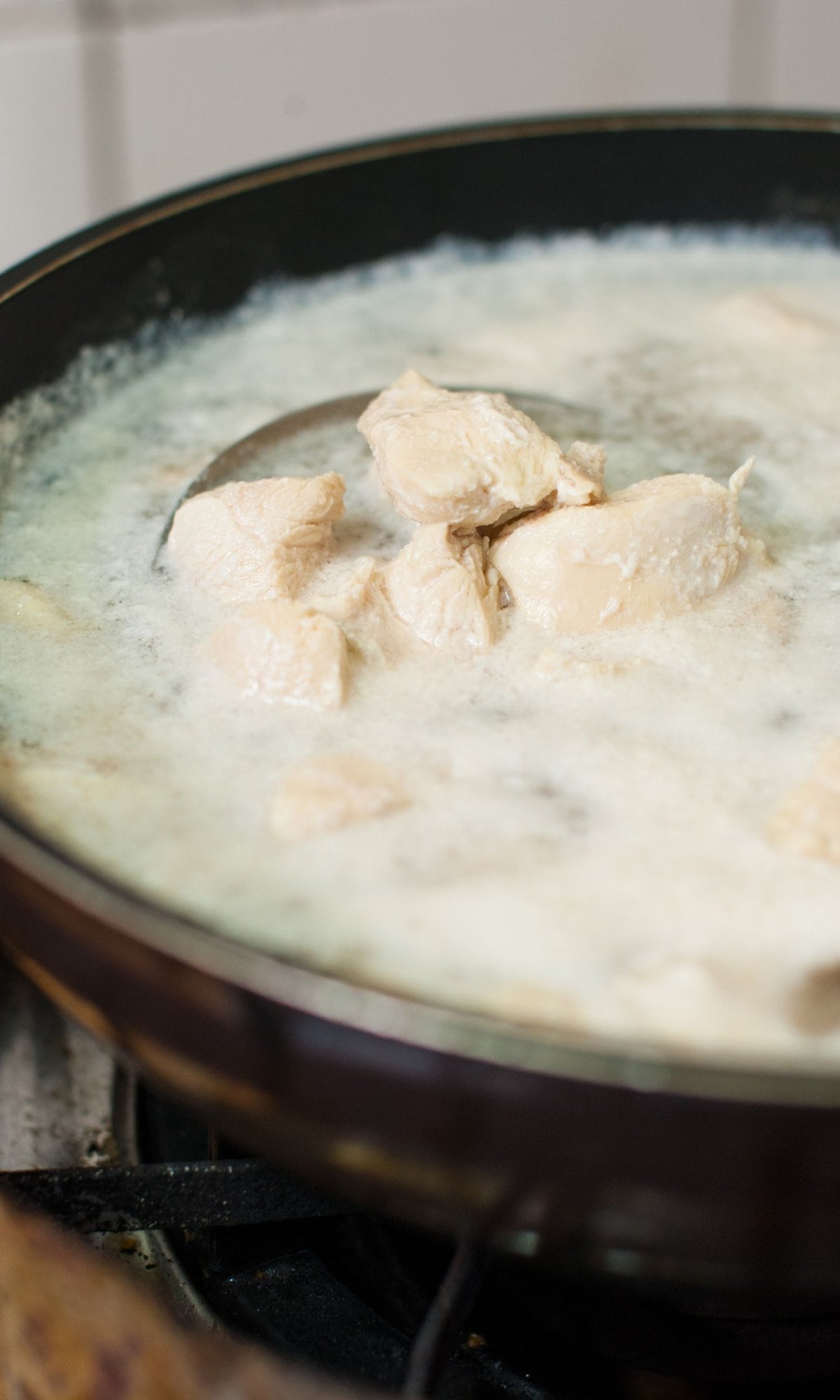 chicken boiling in a pot