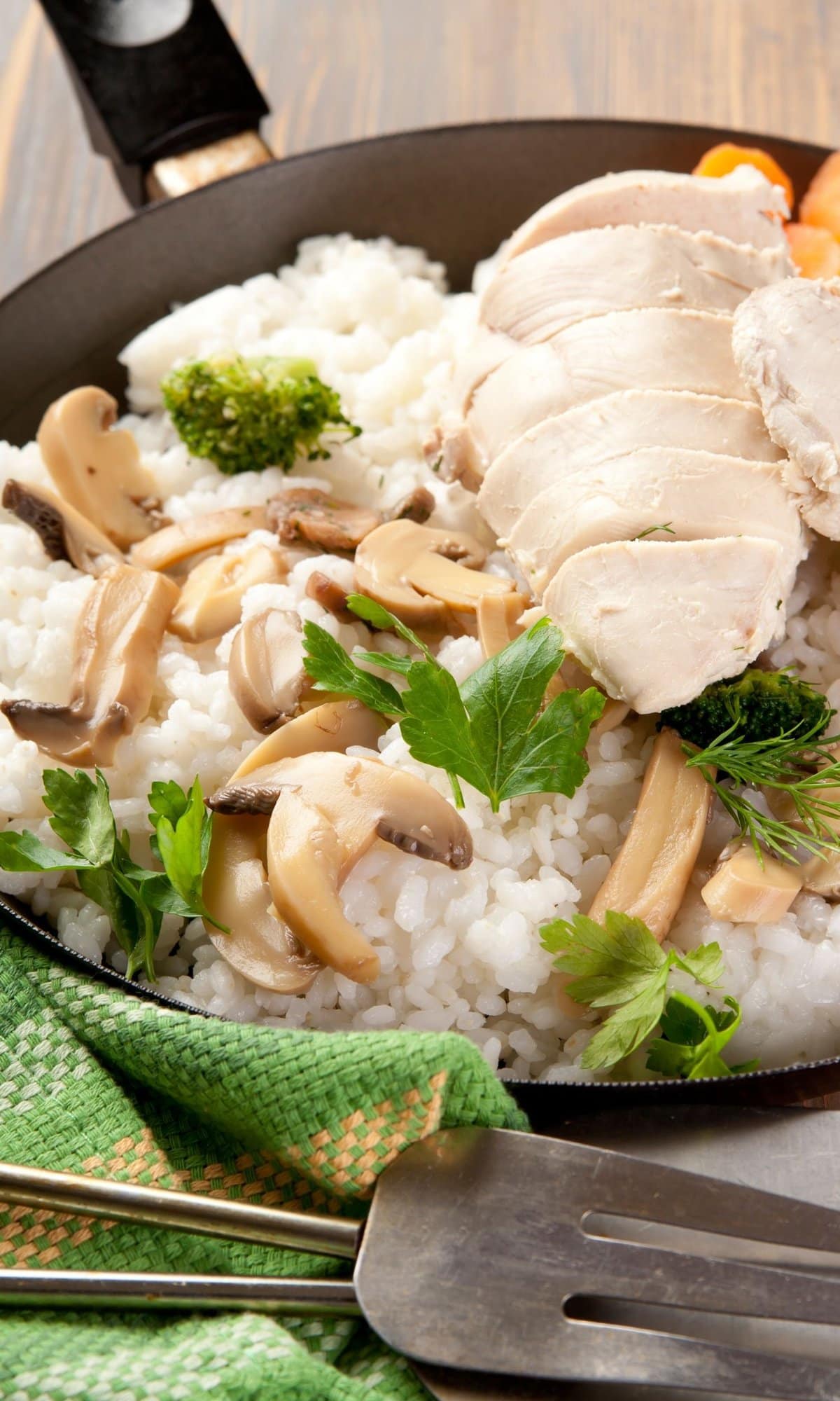 chicken and rice with broccoli in a pan